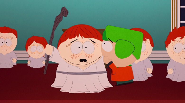 Kyle whispers in Cartman's ear