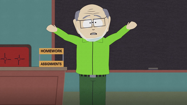 Mr. Garrison standing in front of the chalkboard