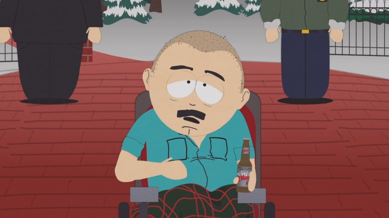 Randy in wheelchair drinking