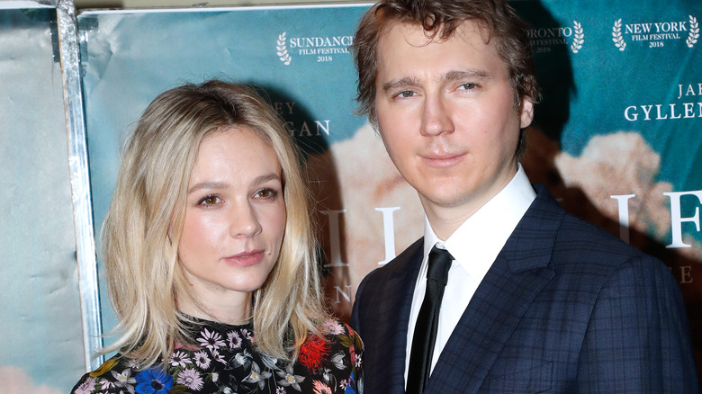 Carey Mulligan standing with Paul Dano