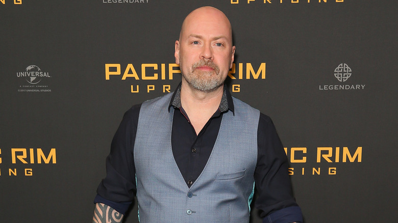 Steven S. DeKnight wearing grey vest