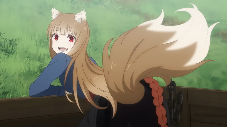 Holo looking back leaning in cart