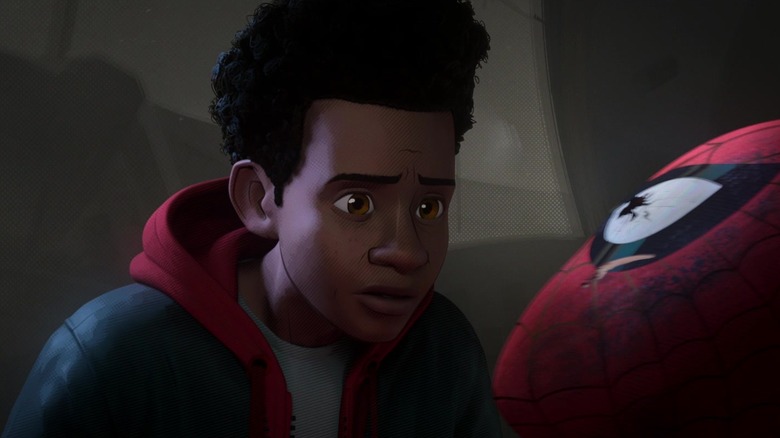 Miles Morales looking at beaten Spider-Man