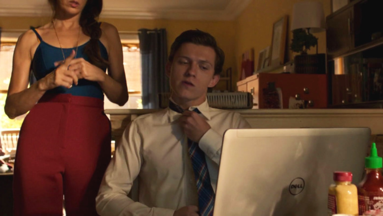 Peter Parker puts on tie