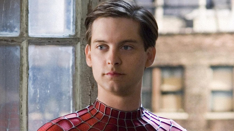 Tobey Maguire looks left