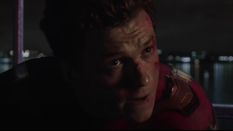 Tom Holland looks up as Spider-Man in "Spider-Man: No Way Home"