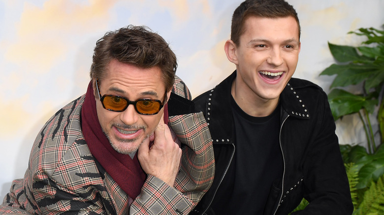 Robert Downey Jr. and Tom Holland smile together