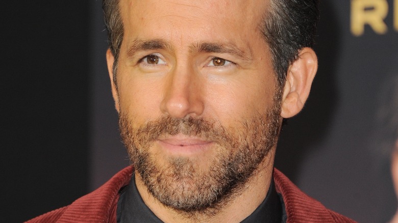 Ryan Reynolds smiling and looking off camera