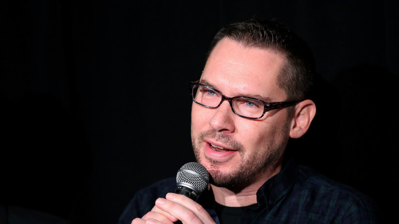 Bryan Singer holding mic talking