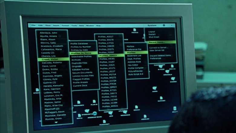 Mystique using computer displaying lots of names