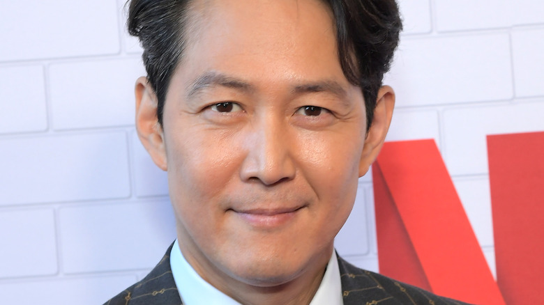 Lee Jung-jae smiling into camera