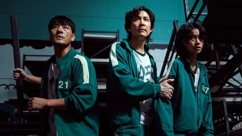 Seong Gi-hun, Kang Sae-Byeok, and Cho Sang-woo prepare for battle in "Squid Game"