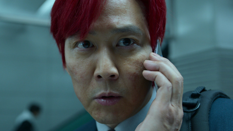 Seong Gi-hun talks with the Front Man on the phone in "Squid Game" (2021)