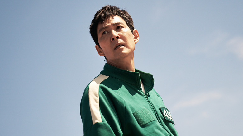 Seong Gi-hun looking out against blue sky in Squid Game Season 2