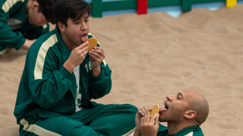 Players licking cookies