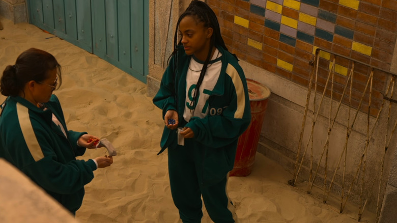 Jada and Mai holding marbles