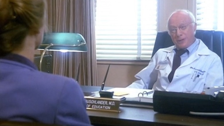 Norman Lloyd at desk