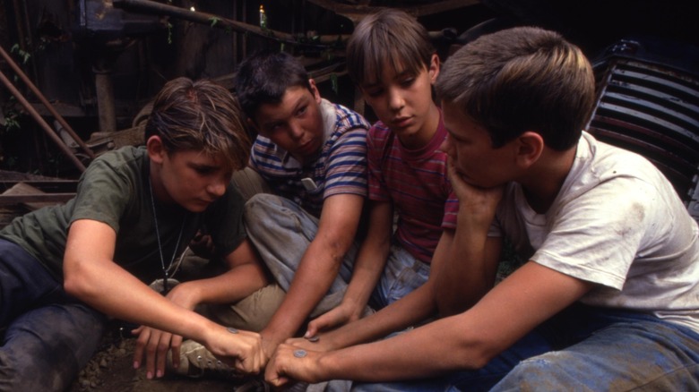 The Stand By Me boys playing coin toss 