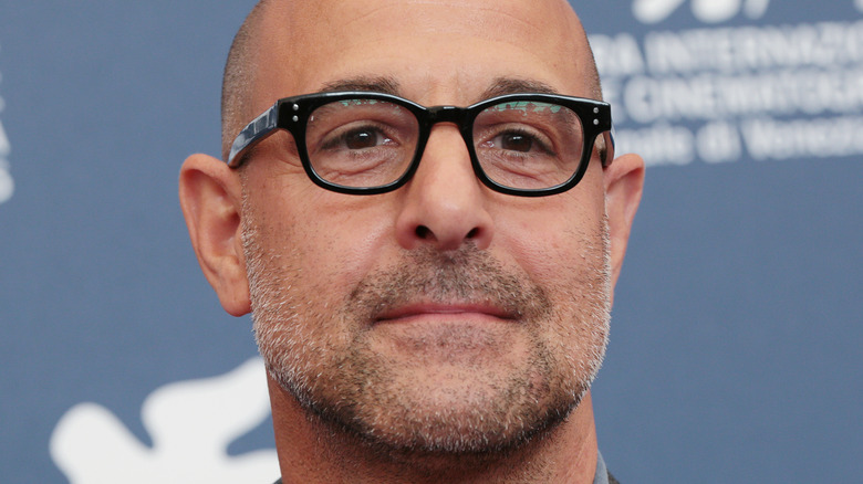 Stanley Tucci posing at an event