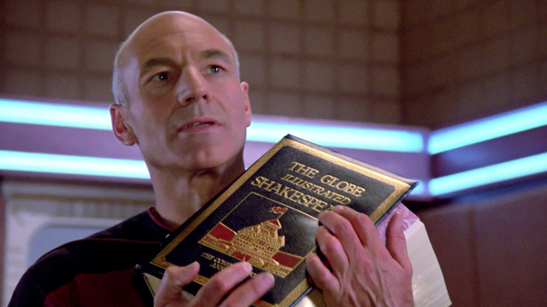 Jean-Luc Picard holds a book of Shakespeare plays