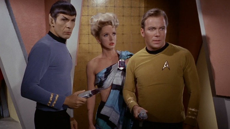 Spock, Mea 3, and Kirk with disruptors in A Taste of Armageddon