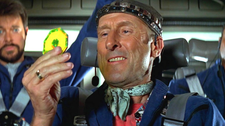 Zefram Cochrane holding a disc