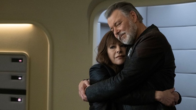 Deanna Troi and Jonathan Frakes embracing