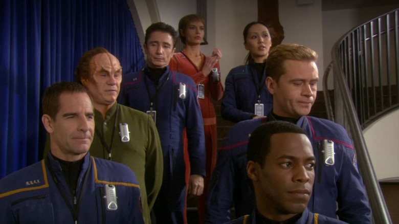 The Enterprise crew stands on a stairwell