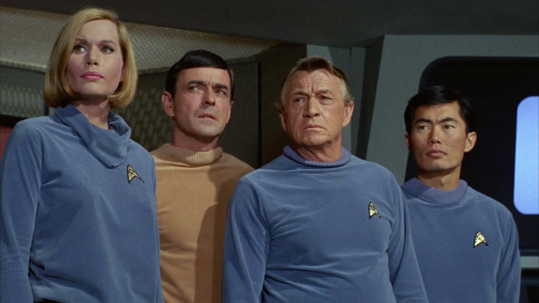 Dr. Dehner, Scotty, Dr. Piper, and Sulu stand in "Where No Man Has Gone Before"