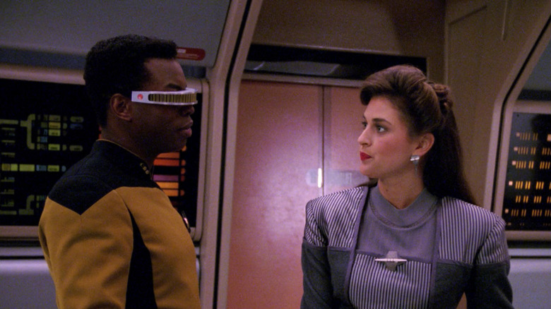 Geordi looks at his hologram girlfriend