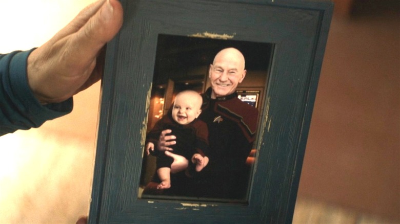 Picard holding Thad in a picture