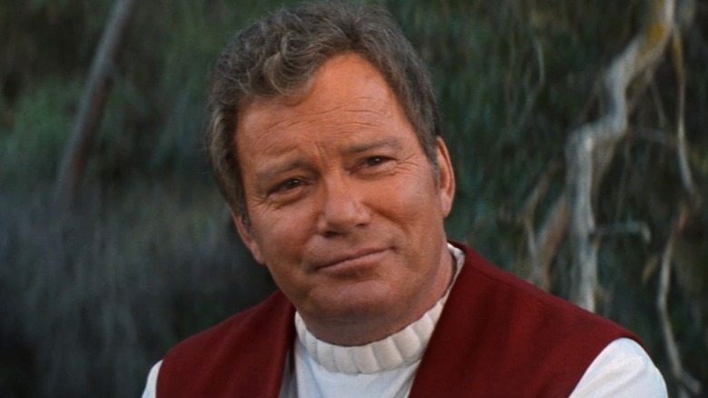 Kirk smiles at Picard