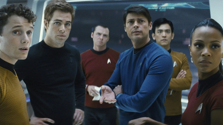 Bones with Kirk and officers of USS Enterprise