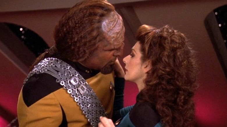 Troi and Worf almost kissing