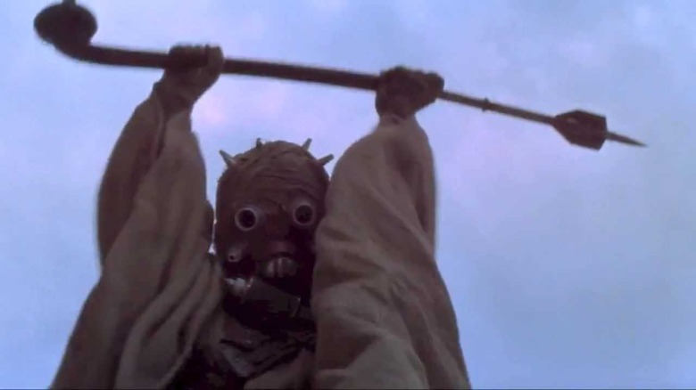 Tusken Raider cheering holding pike