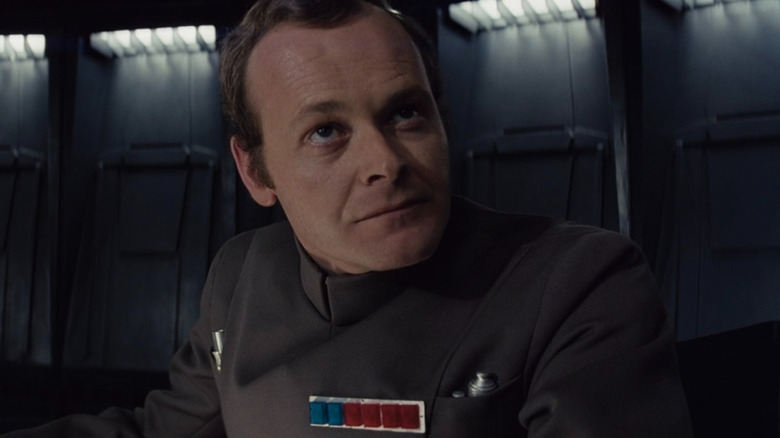 Admiral Motti smugly glances upward in "Star Wars" (1977)