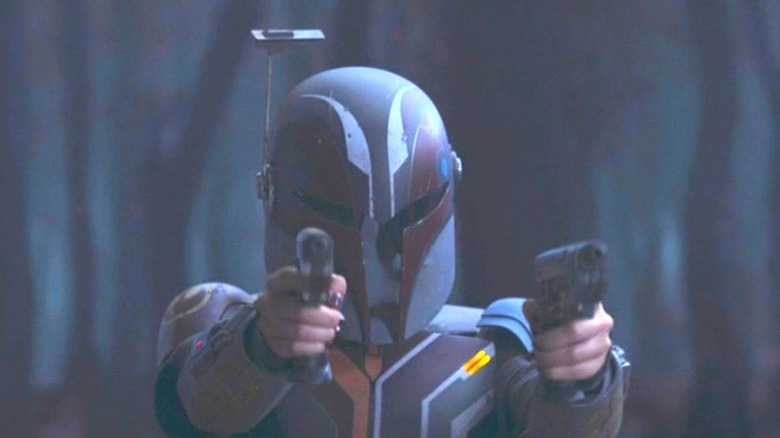 Sabine in Mandalorian armor wielding pistols