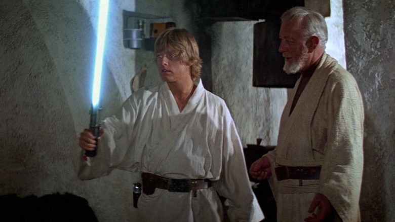 Luke and Obi-wan with lightsaber