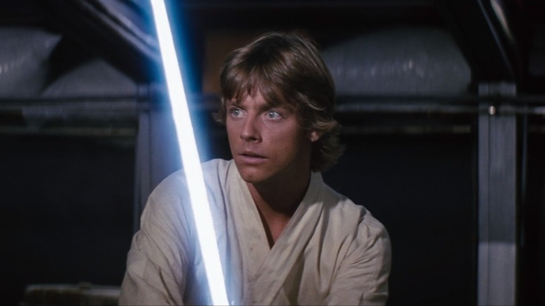 Luke Skywalker holding lightsaber