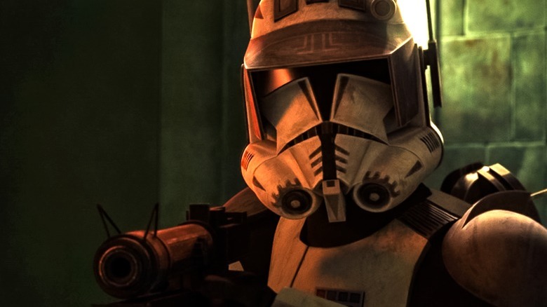 Commander Cody holding his blaster