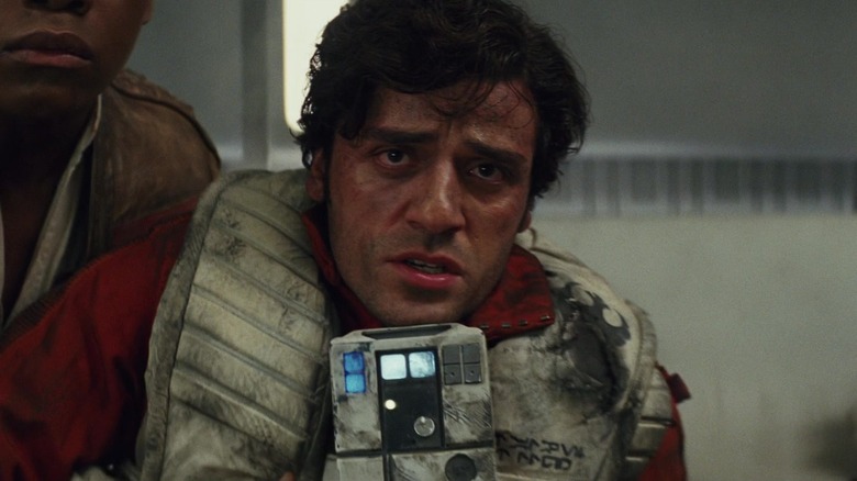 Poe Dameron held by Finn