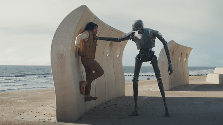 Cassian Andor being attacked by a Droid