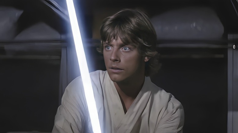 Luke Skywalker wielding a lightsaber 