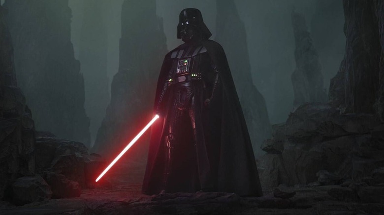 Darth Vader holding a lightsaber