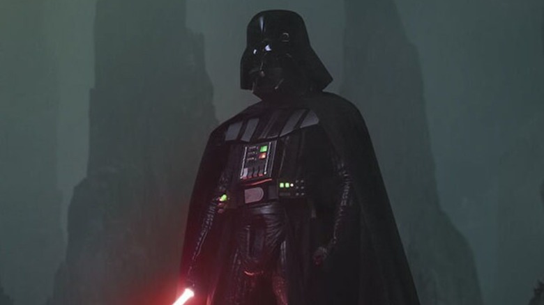 Darth Vader holding his lightsaber