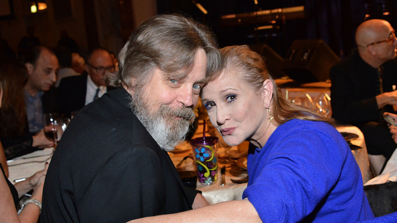 Fisher poses for a photo with fellow "Star Wars" legend Mark Hamill