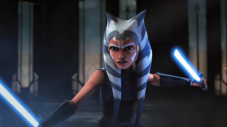 Ahsoka holding two blue lightsabers