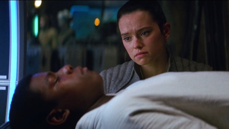 Rey watches over Finn