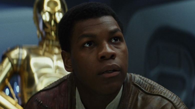 Finn in front of C-3PO