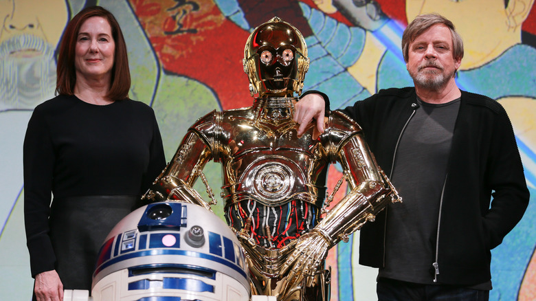 Kathleen Kennedy poses with C-3PO, R2D2, and Mark Hamill